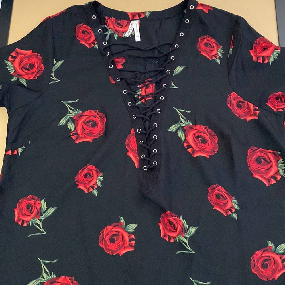 Size 2x lace up black blouse with roses. Never worn.
